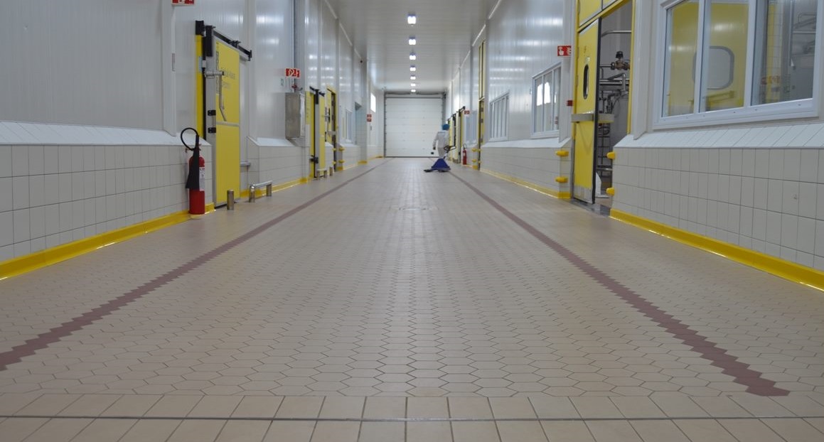 hallway tiled flooring at a food plant facility