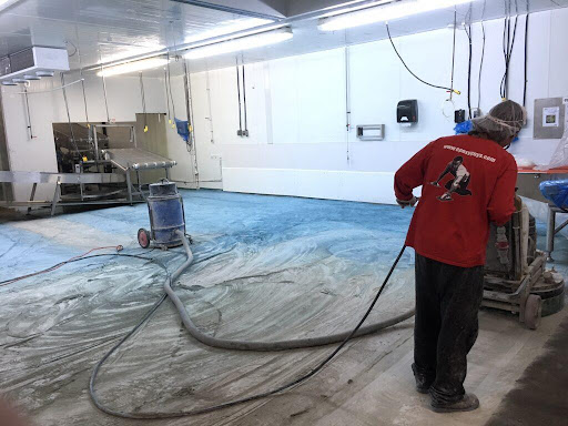 epoxyguys contractor preparing floor with machine