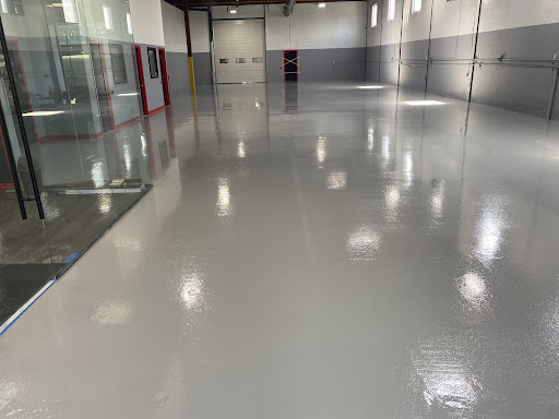 cleared out automotive garage with epoxy flooring